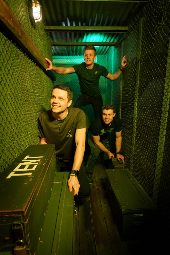 Three guys in military setting