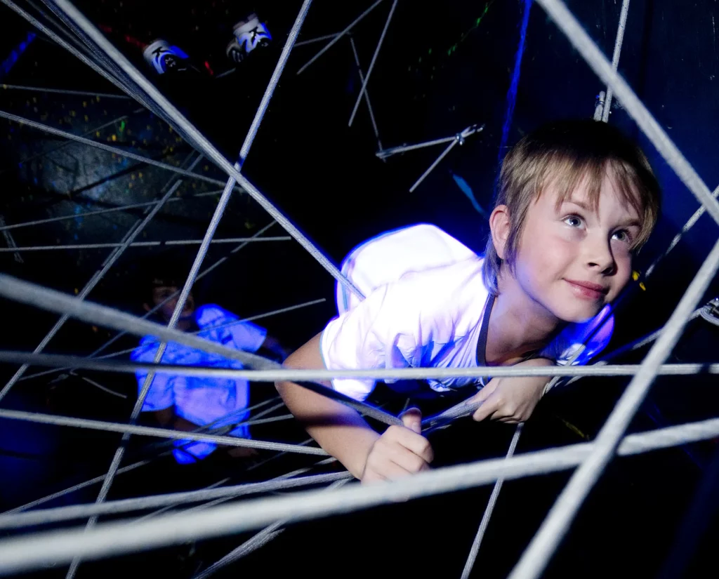 Child in bungee cords