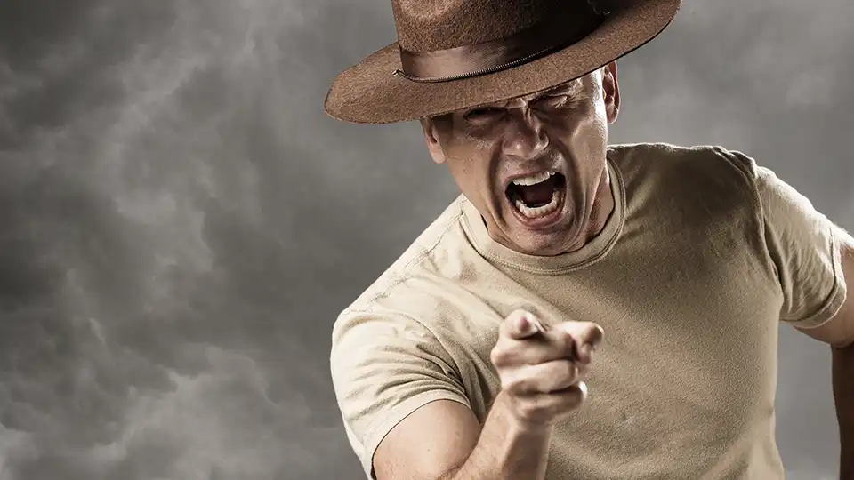 man pointing and screaming
